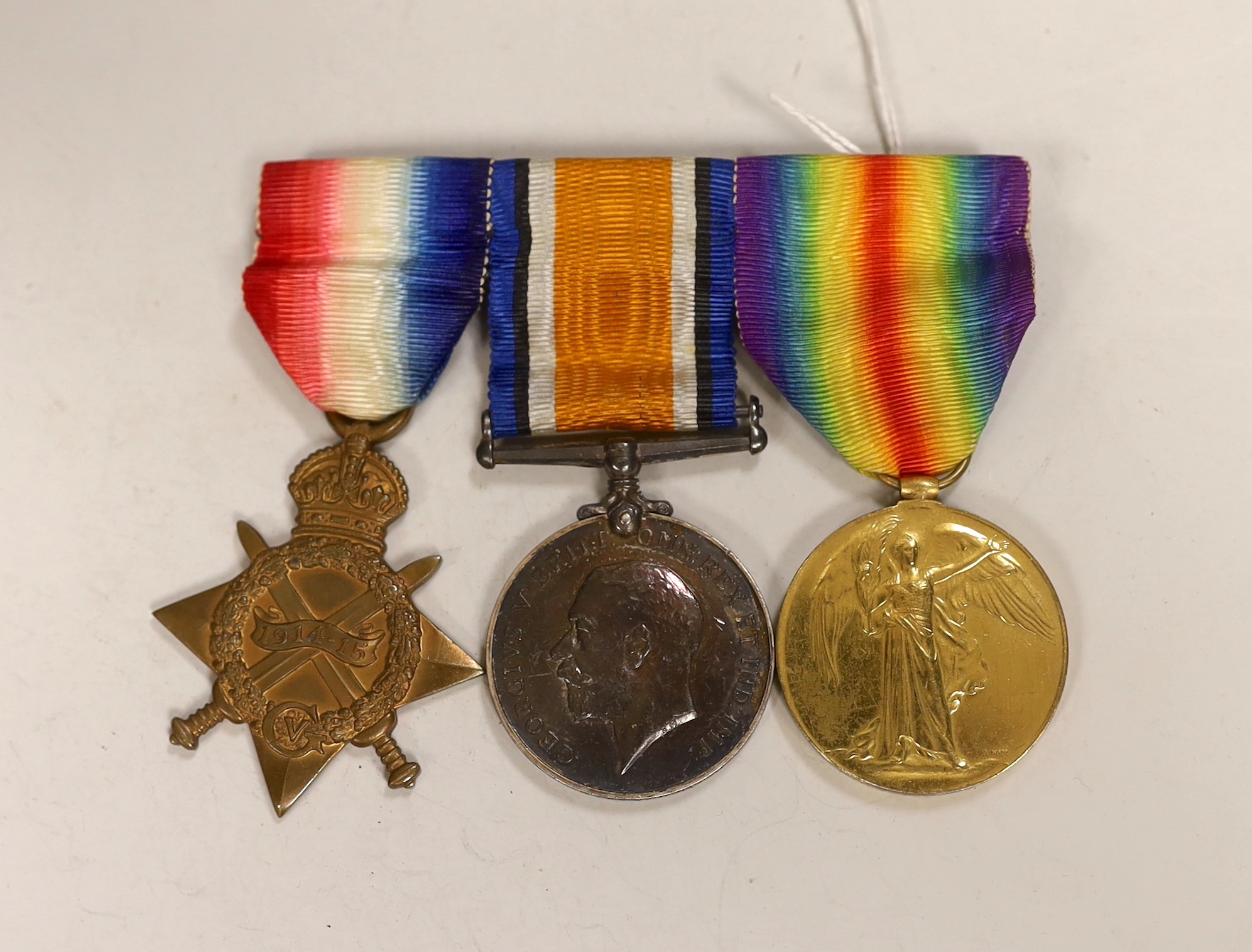 A WWI trio to St. Surgeon Commander P.F. Alderson R.N., comprising 1914 Star, British War Medal and Victory Medal, mounted on pin brooch